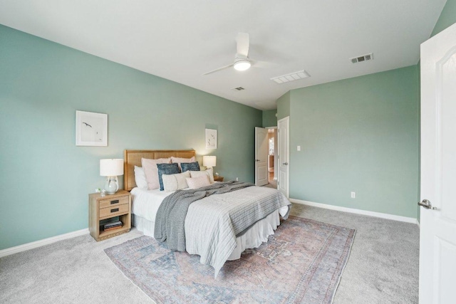 carpeted bedroom featuring ceiling fan, visible vents, and baseboards