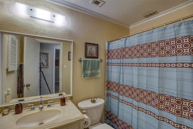 bathroom featuring visible vents, a textured wall, and a textured ceiling