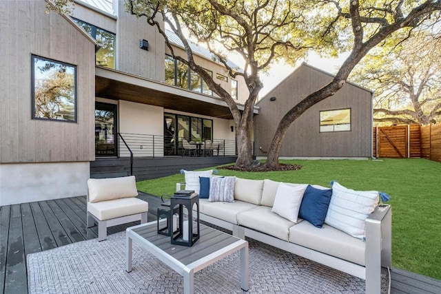 exterior space featuring a yard, an outdoor living space, and fence