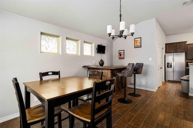 903 Mclaury Cv, Killeen, TX 76542 - dining space featuring a chandelier and dark wood-style flooring