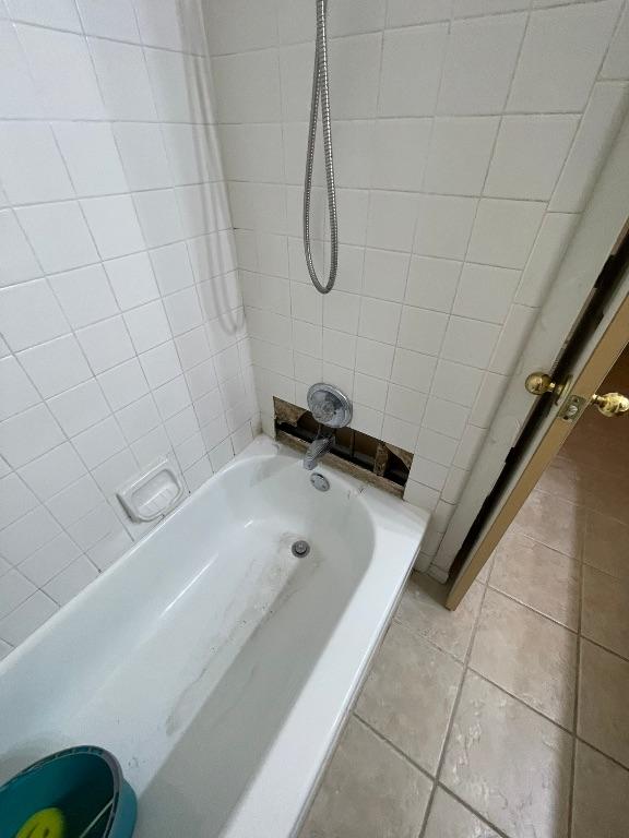 full bathroom featuring tile patterned flooring and shower / tub combination