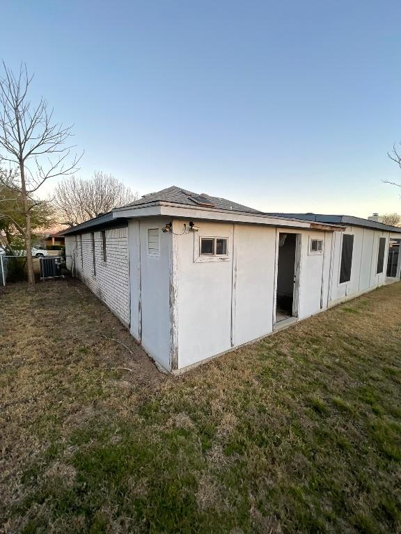 view of outbuilding with fence