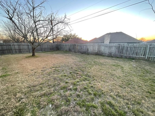 view of yard with a fenced backyard