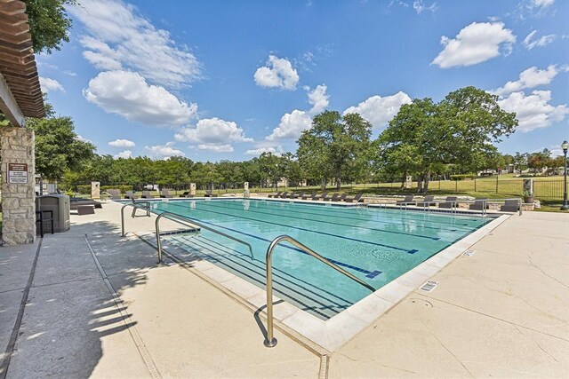 pool with a patio area