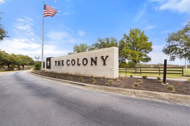 community sign with fence