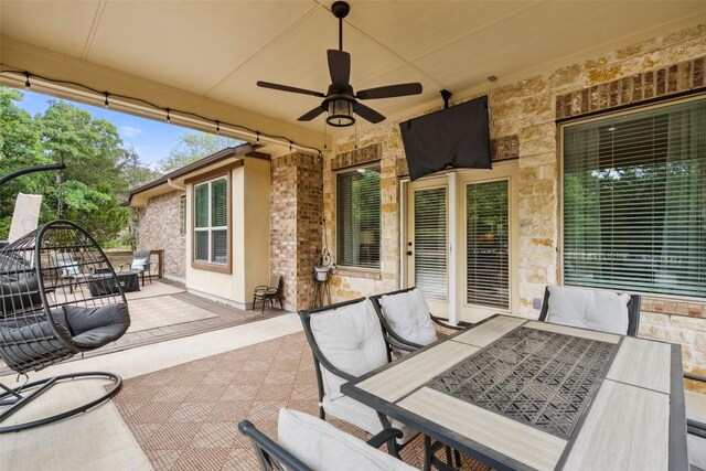 view of patio with ceiling fan and outdoor dining space