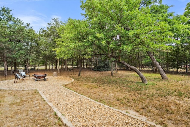 view of yard with a fire pit