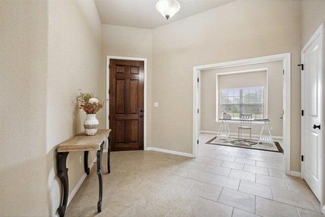 foyer entrance with baseboards