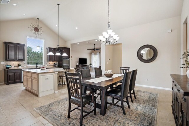 dining area with high vaulted ceiling, ceiling fan with notable chandelier, recessed lighting, light tile patterned floors, and visible vents