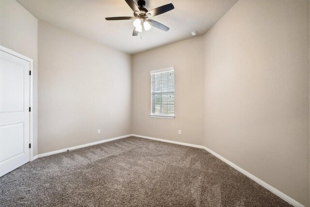 carpeted empty room with baseboards and ceiling fan