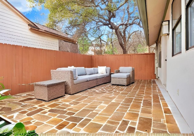 view of patio with outdoor lounge area and a fenced backyard