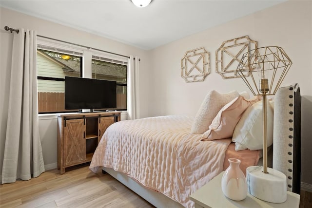 bedroom featuring light wood-style flooring