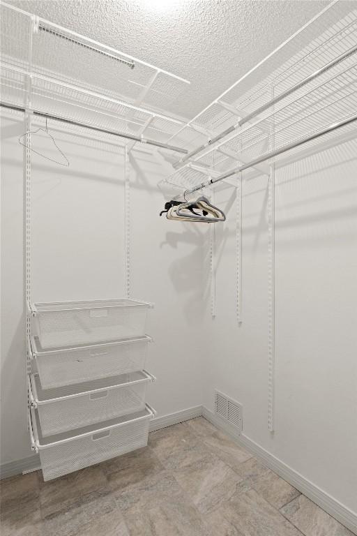 spacious closet with visible vents