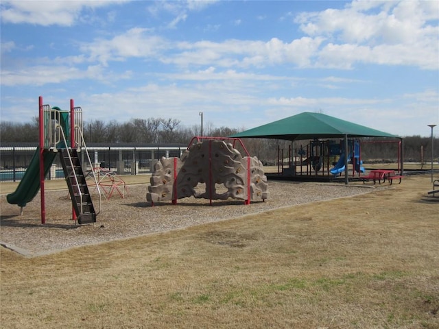 community jungle gym featuring fence