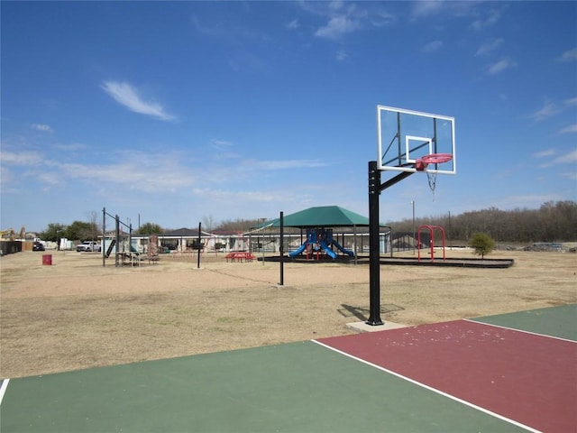 view of basketball court featuring playground community and community basketball court