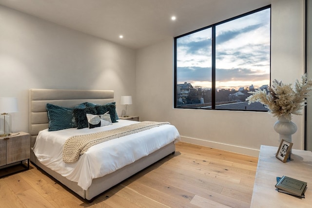 bedroom featuring recessed lighting, baseboards, and hardwood / wood-style floors