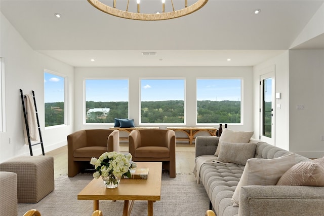 living area featuring recessed lighting, visible vents, and baseboards