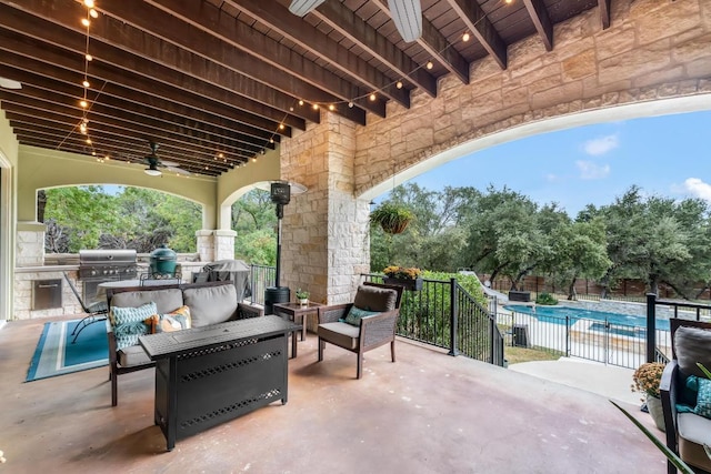 view of patio with a fenced in pool, area for grilling, a grill, fence, and an outdoor living space