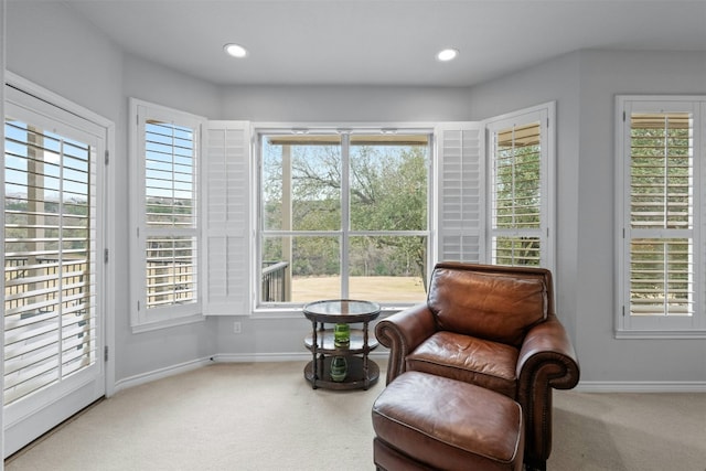 living area featuring recessed lighting, carpet flooring, and baseboards