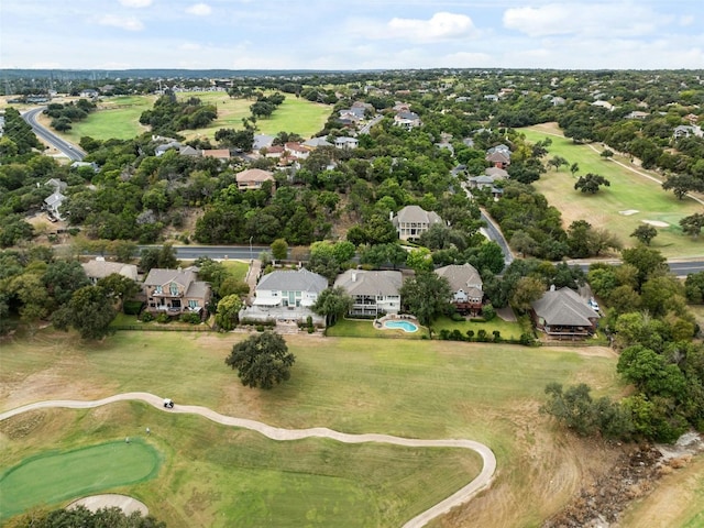 birds eye view of property with view of golf course