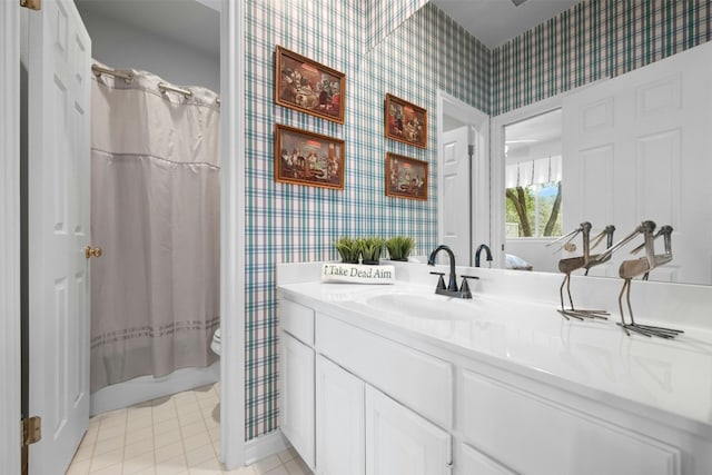 bathroom with toilet, shower / bath combo, vanity, tile patterned flooring, and wallpapered walls