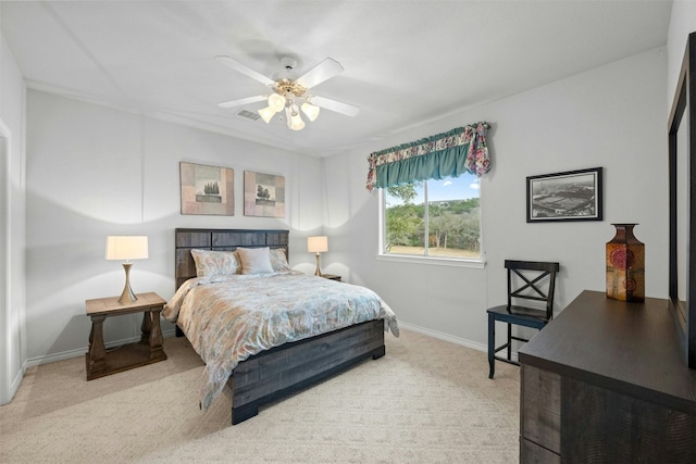 bedroom with baseboards, visible vents, a ceiling fan, and carpet flooring