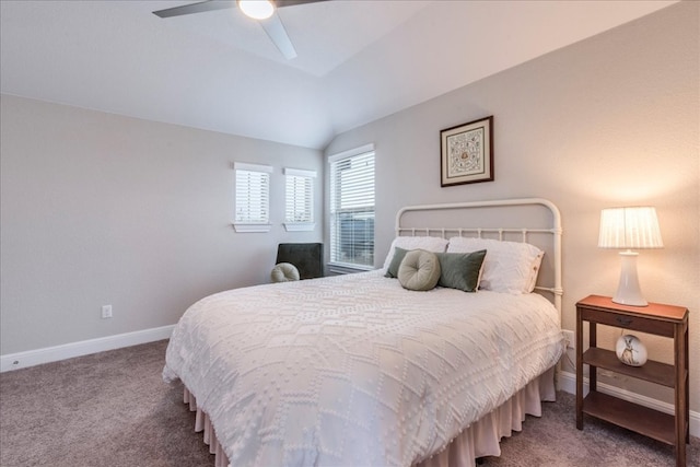 carpeted bedroom featuring vaulted ceiling, baseboards, and ceiling fan