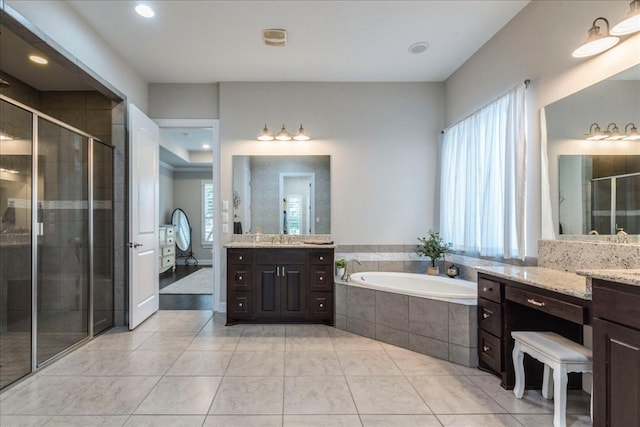 bathroom with a garden tub, recessed lighting, a shower stall, vanity, and tile patterned flooring