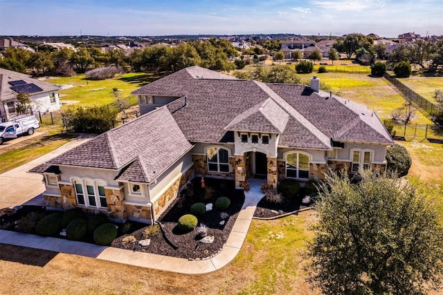 birds eye view of property with a residential view