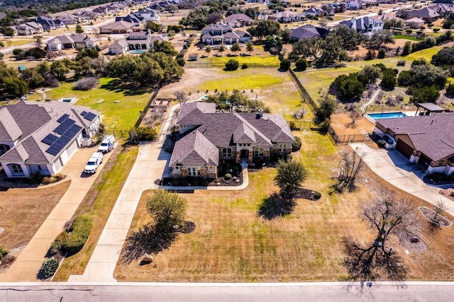 birds eye view of property with a residential view