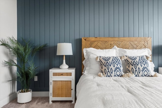 carpeted bedroom with baseboards