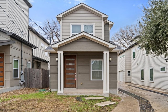 view of front of home featuring fence