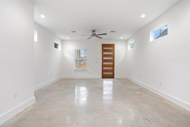 empty room with baseboards, finished concrete floors, visible vents, and recessed lighting