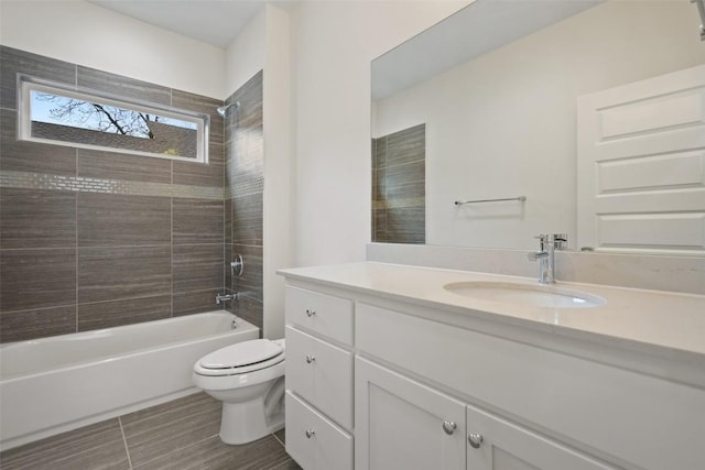 bathroom featuring shower / bathtub combination, vanity, and toilet