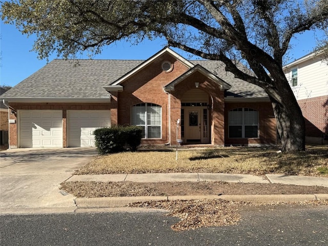 ranch-style home featuring an attached garage, concrete driveway, brick siding, and a shingled roof