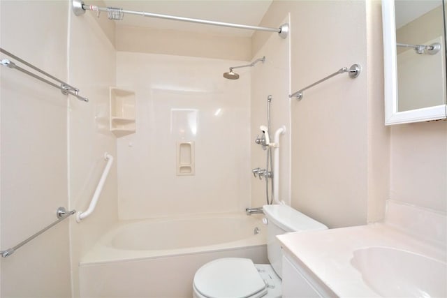 bathroom with toilet, washtub / shower combination, and vanity