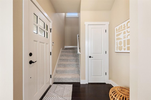 interior space with wood finished floors and baseboards