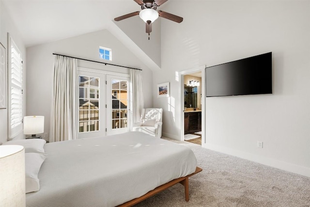 bedroom with carpet flooring, ceiling fan, ensuite bath, high vaulted ceiling, and baseboards