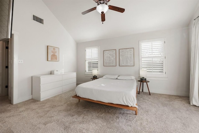 carpeted bedroom with lofted ceiling, ceiling fan, visible vents, and baseboards