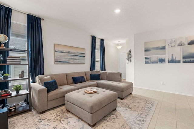 living room featuring recessed lighting, baseboards, and tile patterned floors