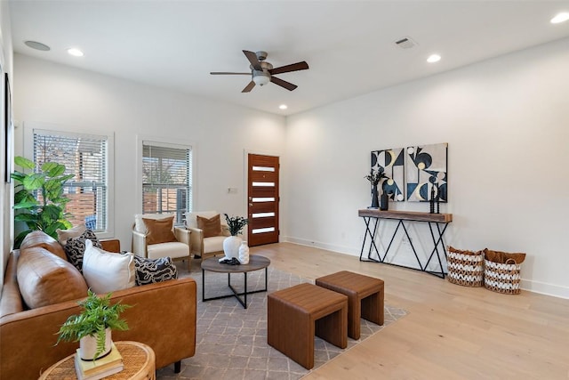 living area with ceiling fan, visible vents, wood finished floors, and recessed lighting