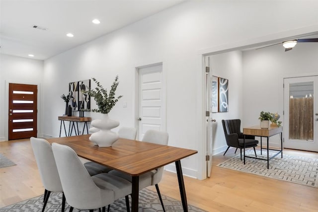 dining space featuring light wood-style flooring, visible vents, baseboards, and recessed lighting