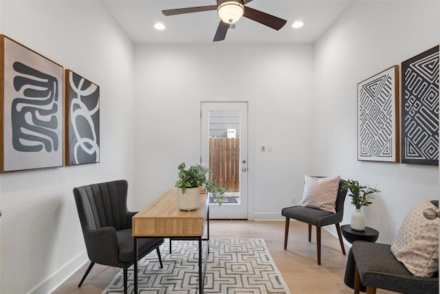 interior space with ceiling fan, light wood-type flooring, baseboards, and recessed lighting