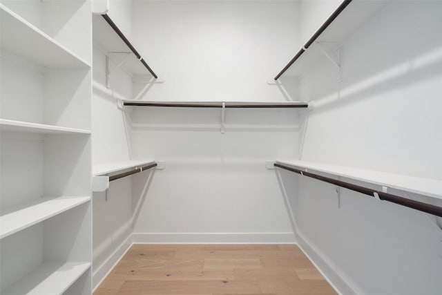 walk in closet featuring light wood-style floors