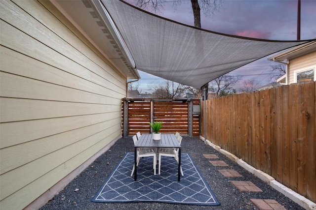 patio terrace at dusk with fence