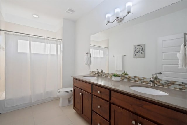 full bathroom with tasteful backsplash, plenty of natural light, visible vents, and a sink