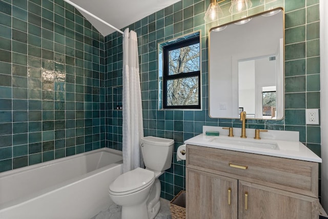 bathroom with a wealth of natural light, shower / bath combo with shower curtain, and tile walls