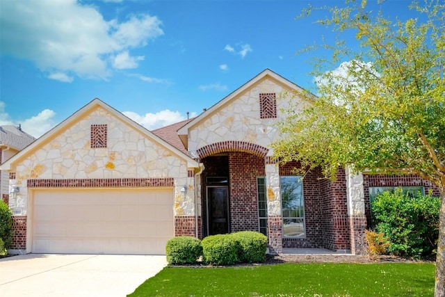 view of front facade featuring driveway, a garage, stone siding, a front lawn, and brick siding