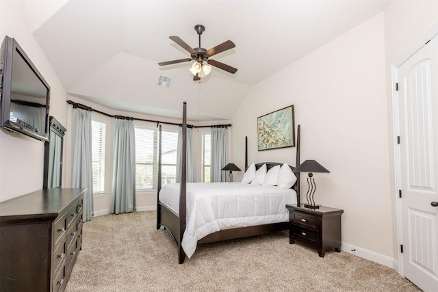 bedroom featuring lofted ceiling, baseboards, visible vents, and light colored carpet