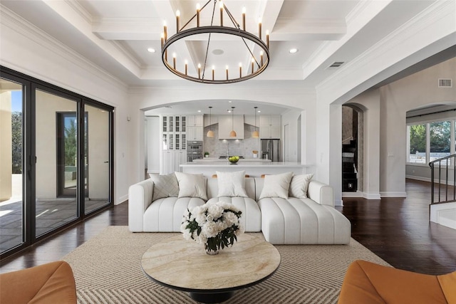 living area with arched walkways, coffered ceiling, ornamental molding, dark wood-type flooring, and beamed ceiling